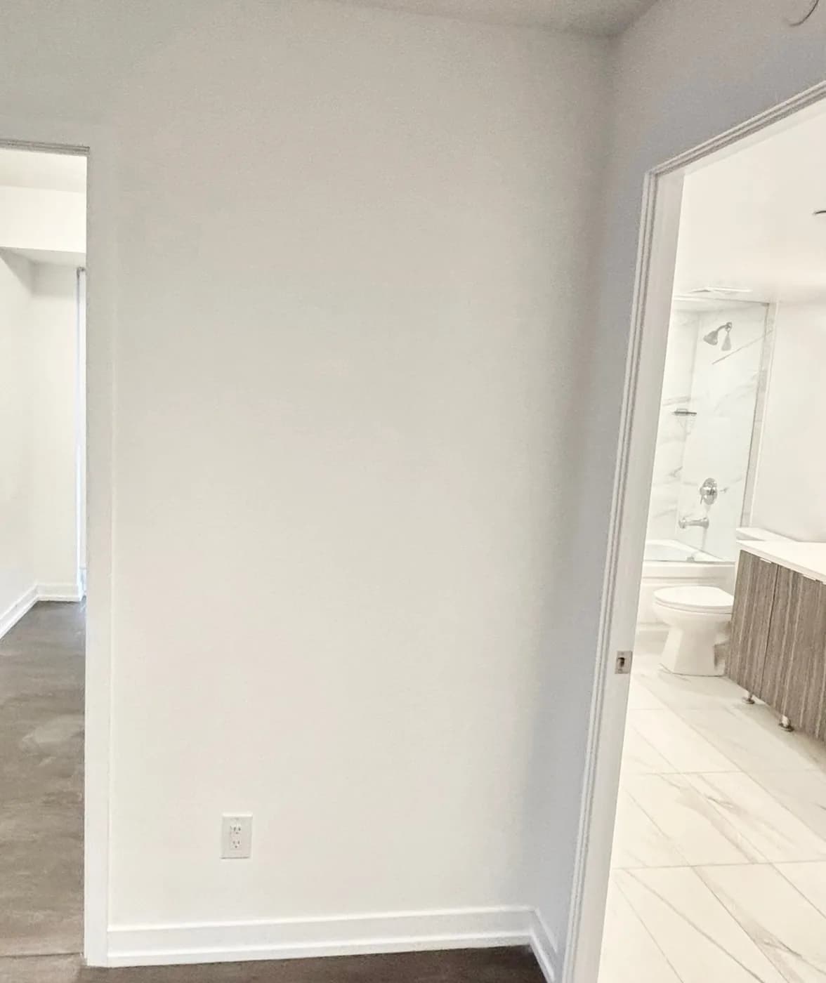 After: the same wall sanded smooth and repainted white, by Task Magic Handyman