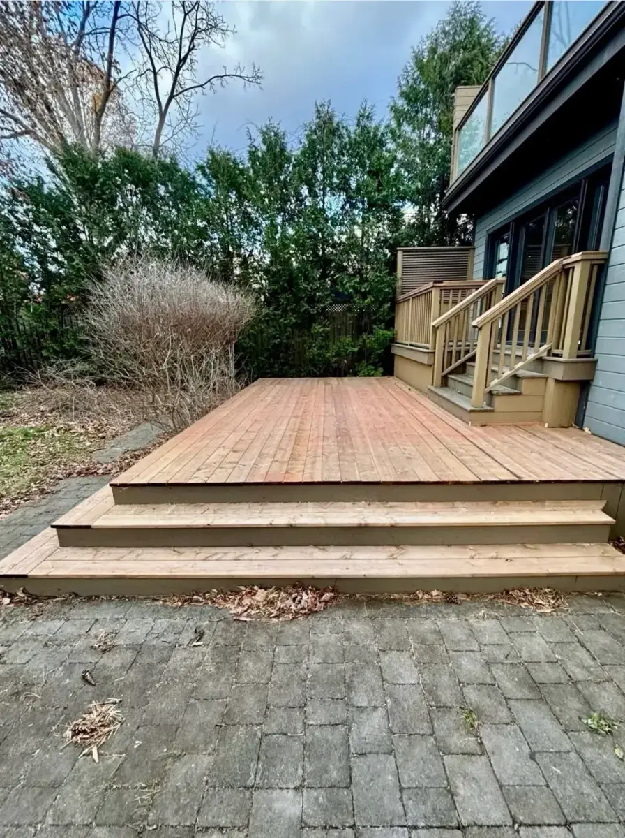 After: the deck rebuilt and refinished with new stairs by Task Magic Handyman